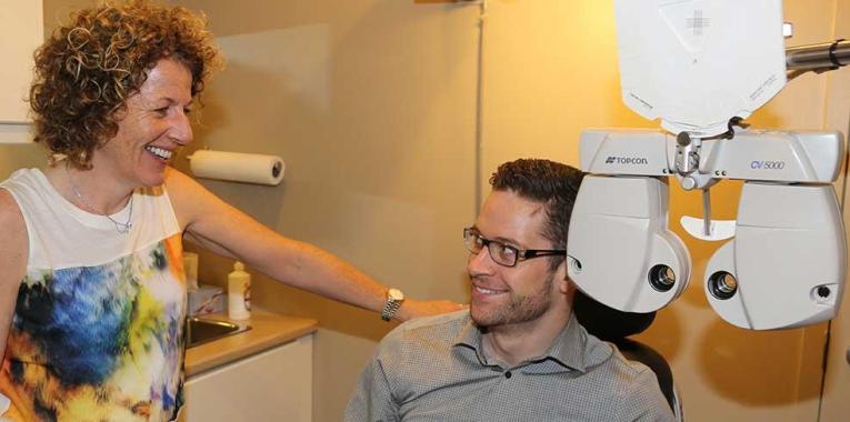 optometrist speaking with patient